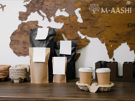 Box of ReNew product next to a trash can filled with hard to recycled plastics that coordinate with the waste this program accepts